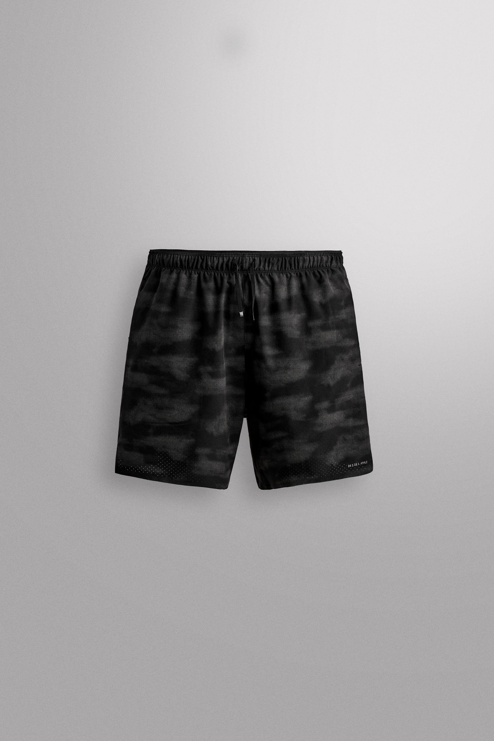 PERFORATED RUNNING SHORTS